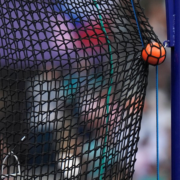 FILE - A hammer is caught by the safety net during the men's hammer throw qualification at the 2024 Summer Olympics, Aug. 2, 2024, in Saint-Denis, France. (AP Photo/Matthias Schrader, File)