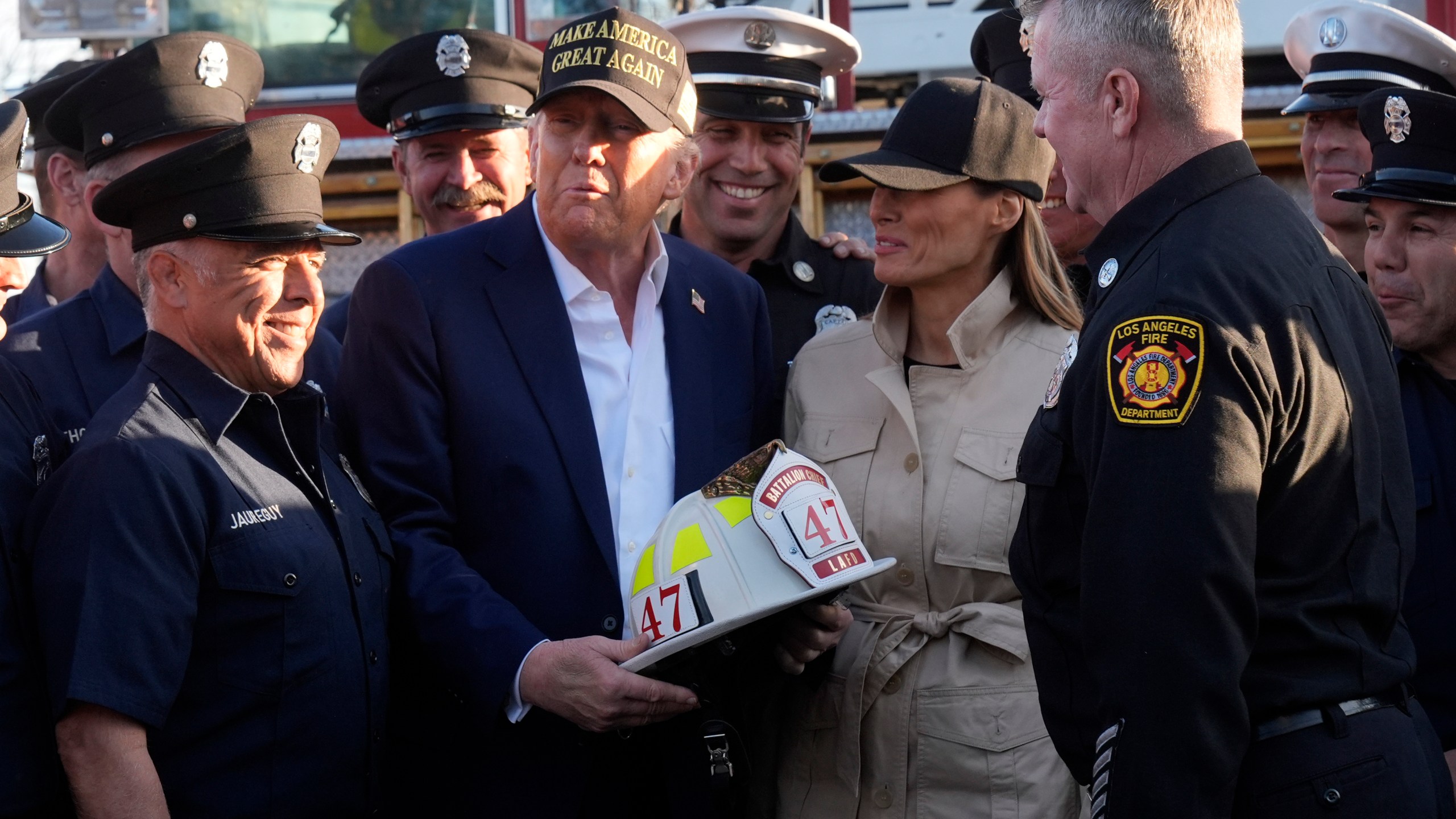 FILE - President Donald Trump and first lady Melania Trump talk with Los Angeles firefighters as they tour the Pacific Palisades neighborhood affected by recent wildfires in Los Angeles, Friday, Jan. 24, 2025. (AP Photo/Mark Schiefelbein, File)