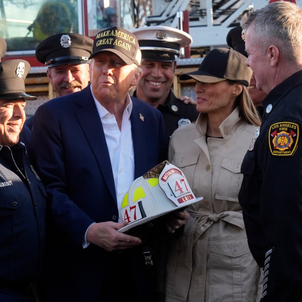 FILE - President Donald Trump and first lady Melania Trump talk with Los Angeles firefighters as they tour the Pacific Palisades neighborhood affected by recent wildfires in Los Angeles, Friday, Jan. 24, 2025. (AP Photo/Mark Schiefelbein, File)