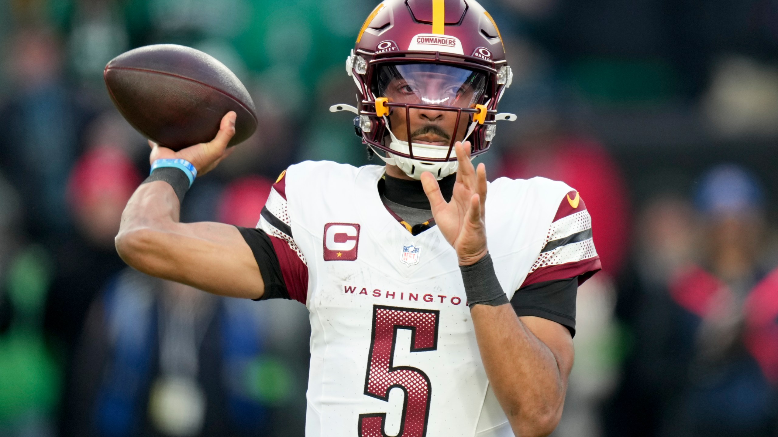 Washington Commanders quarterback Jayden Daniels passes against the Philadelphia Eagles during the first half of the NFC Championship NFL football game, Sunday, Jan. 26, 2025, in Philadelphia. (AP Photo/Seth Wenig)