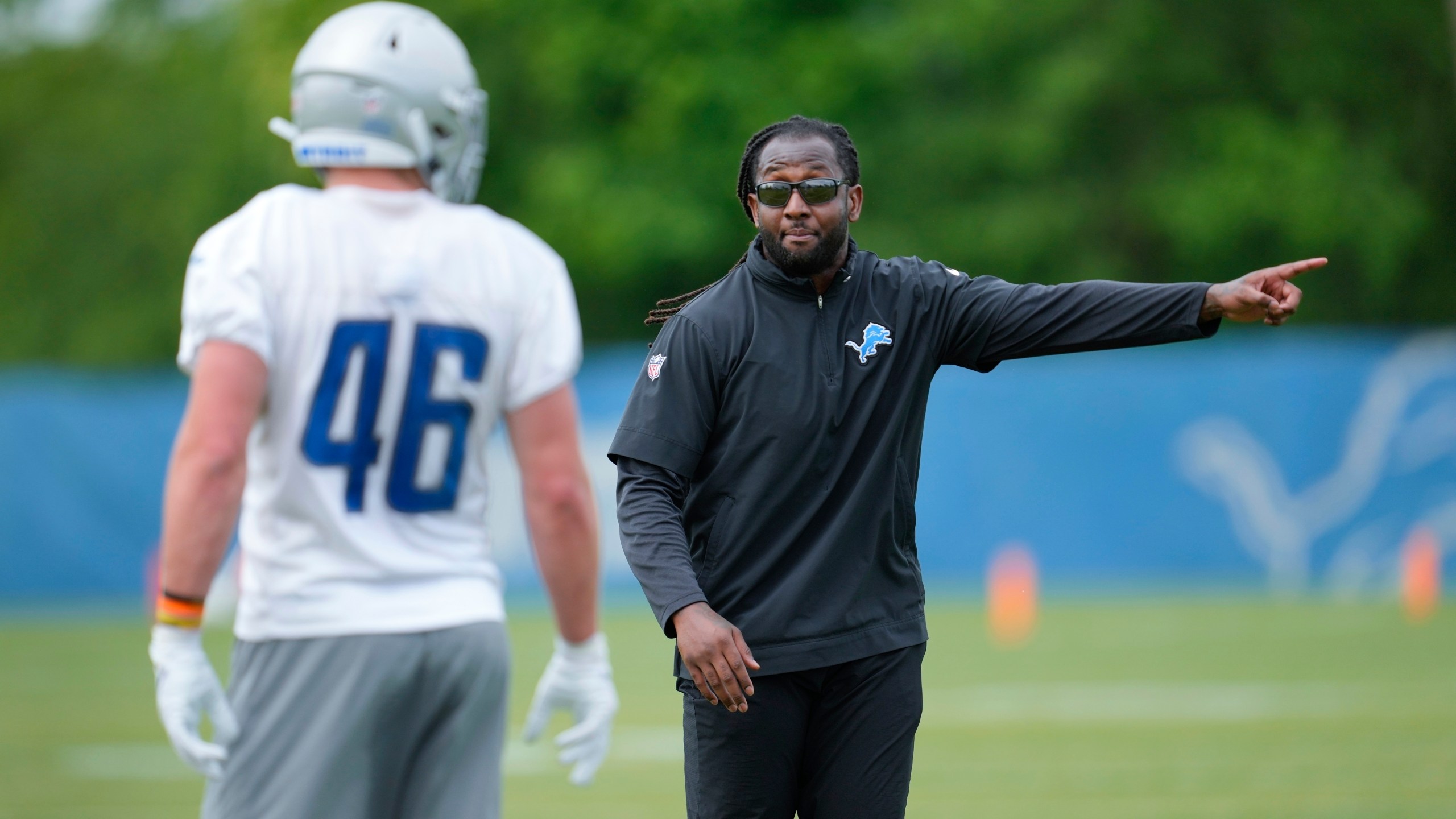 FILE - Detroit Lions linebacker coach Kelvin Sheppard gives instruction to linebacker Jack Campbell (46) during an NFL football rookie minicamp practice in Allen Park, Mich., Saturday, May 13, 2023. (AP Photo/Paul Sancya, File)