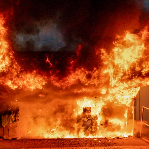 A fire burns at a merchandise kiosk outside the Etihad Stadium before the Champions League opening phase soccer match between Manchester City and Brugge in Manchester, England, Wednesday, Jan. 29, 2025.(AP Photo/Dave Thompson)