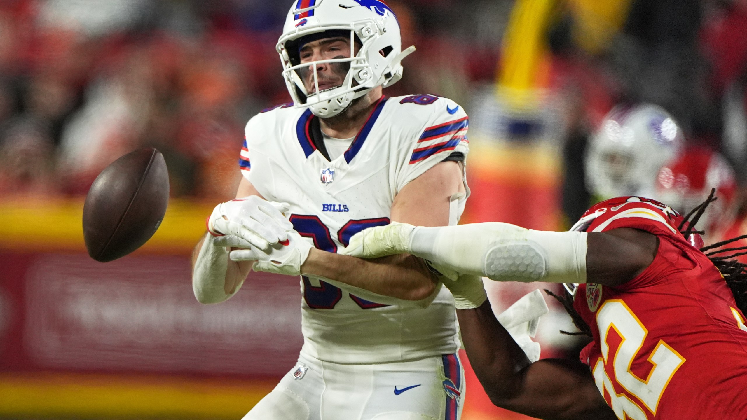 Kansas City Chiefs linebacker Nick Bolton, right, breaks up a pass intended for Buffalo Bills tight end Dalton Kincaid during the first half of the AFC Championship NFL football game, Sunday, Jan. 26, 2025, in Kansas City, Mo. (AP Photo/Charlie Riedel)