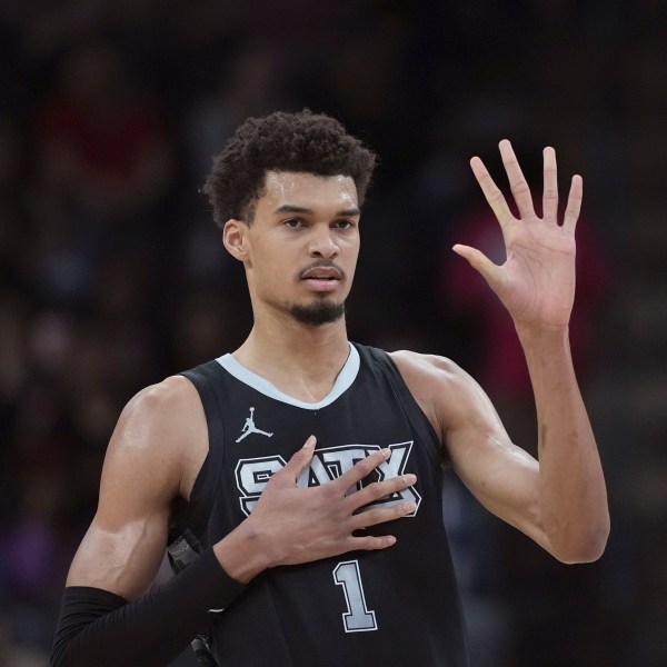 San Antonio Spurs center Victor Wembanyama calls a play during the first half of an NBA basketball game against the LA Clippers in San Antonio, Wednesday, Jan. 29, 2025. (AP Photo/Eric Gay)