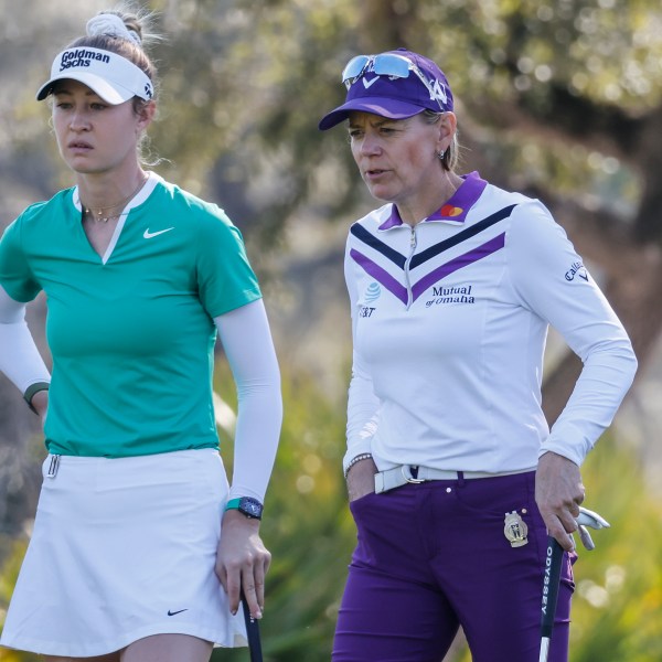 Nelly Korda, left, and Annika Sorenstam, right, talk on the eighth hole during the first round of the Hilton Grand Vacations Tournament of Champions LPGA golf tournament in Orlando, Fla., Thursday, Jan. 30, 2025. (AP Photo/Kevin Kolczynski)