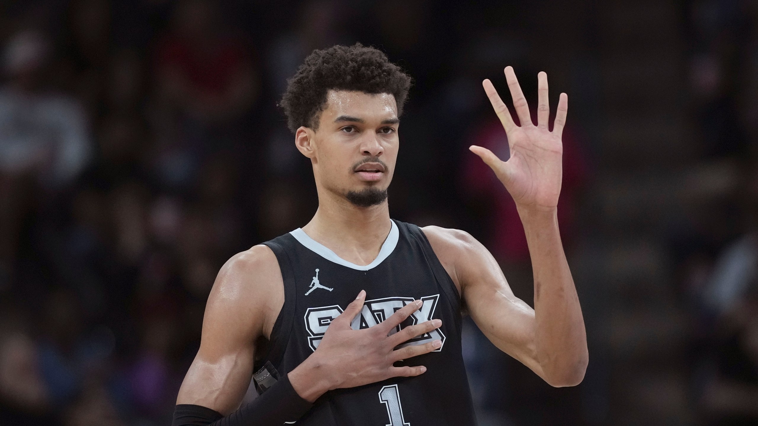 San Antonio Spurs center Victor Wembanyama calls a play during the first half of an NBA basketball game against the LA Clippers in San Antonio, Wednesday, Jan. 29, 2025. (AP Photo/Eric Gay)