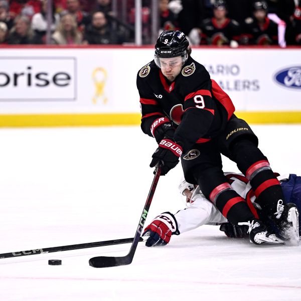 Ottawa Senators' Josh Norris (9) gets tripped by Washington Capitals' John Carlson (74), leading to Norris' penalty shot goal, during second period NHL hockey action in Ottawa, on Thursday, Jan. 30, 2025. (Justin Tang/The Canadian Press via AP)