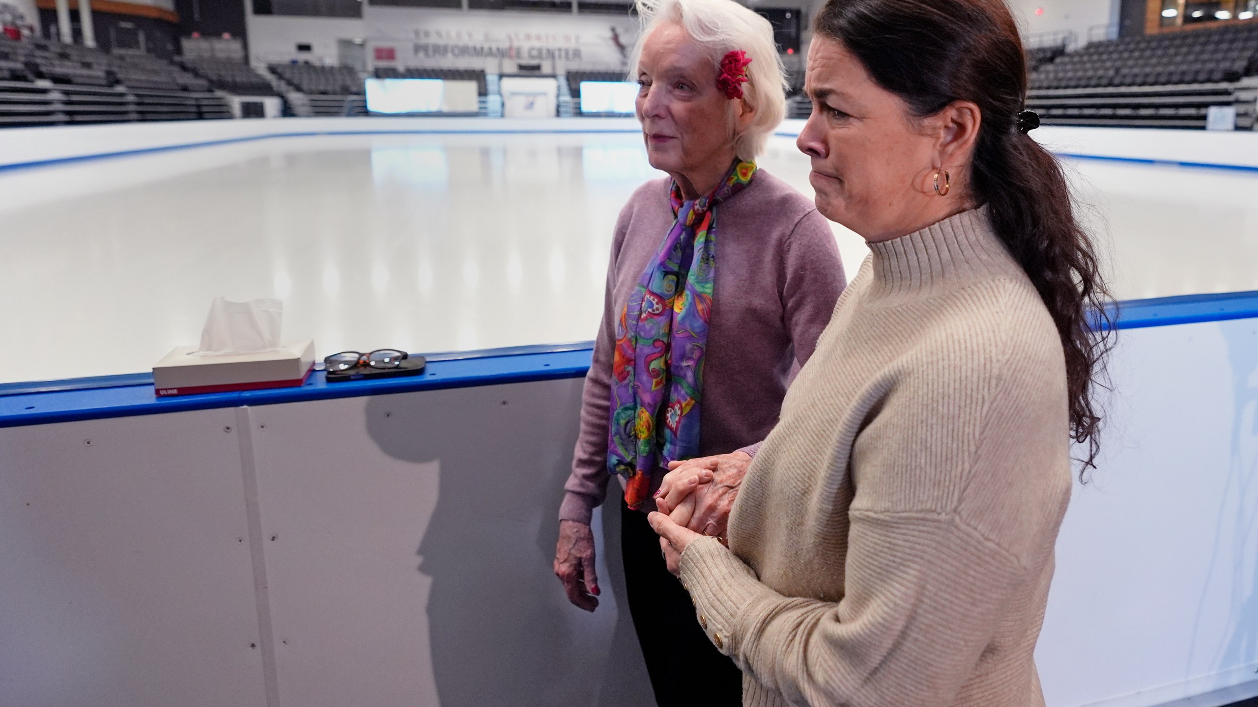 Former Olympic skater Nancy Kerrigan, right, walks with fellow Olympic skater Tenley Albright, at The Skating Club of Boston, where six members of the club's community, including athletes, coaches and family, were killed in an airplane collision with a helicopter on Wednesday in Washington, Thursday, Jan. 30, 2025, in Norwood, Mass. (AP Photo/Charles Krupa)