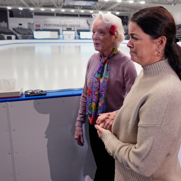 Former Olympic skater Nancy Kerrigan, right, walks with fellow Olympic skater Tenley Albright, at The Skating Club of Boston, where six members of the club's community, including athletes, coaches and family, were killed in an airplane collision with a helicopter on Wednesday in Washington, Thursday, Jan. 30, 2025, in Norwood, Mass. (AP Photo/Charles Krupa)