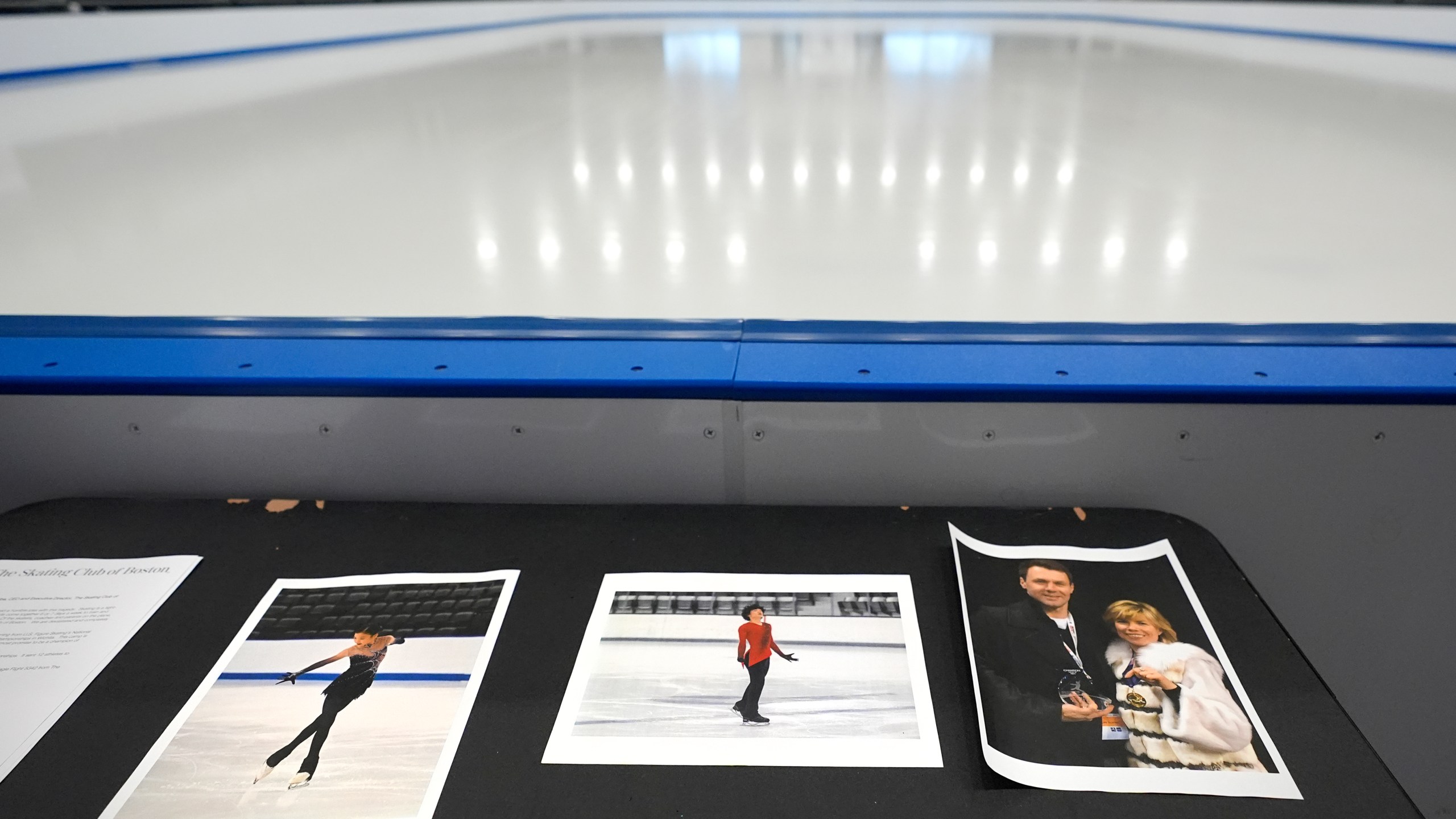 Photographs of aircraft crash victims from The Skating Club of Boston rink are displayed rink side, Thursday, Jan. 30, 2025, in Norwood, Mass. From left is skater Jinna Han, skater Spencer Lane and coaches Vadim Naumov and Evgenia Shishkova. (AP Photo/Charles Krupa)