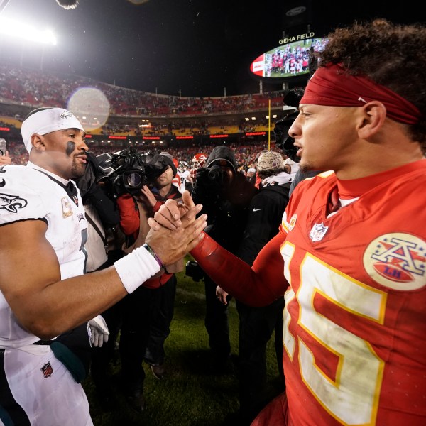 FILE- Philadelphia Eagles quarterback Jalen Hurts, left, and Kansas City Chiefs quarterback Patrick Mahomes (15) shake hands following an NFL football game on Monday, Nov. 20, 2023, in Kansas City, Mo. (AP Photo/Charlie Riedel, File)