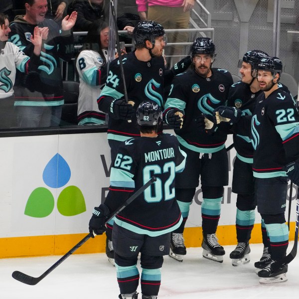 Seattle Kraken center Chandler Stephenson, third from left, celebrates his goal against the San Jose Sharks with teammates Brandon Montour (62), Jamie Oleksiak (24), Eeli Tolvanen and Oliver Bjorkstrand (22) during the first period of an NHL hockey game Thursday, Jan. 30, 2025, in Seattle. (AP Photo/Lindsey Wasson)