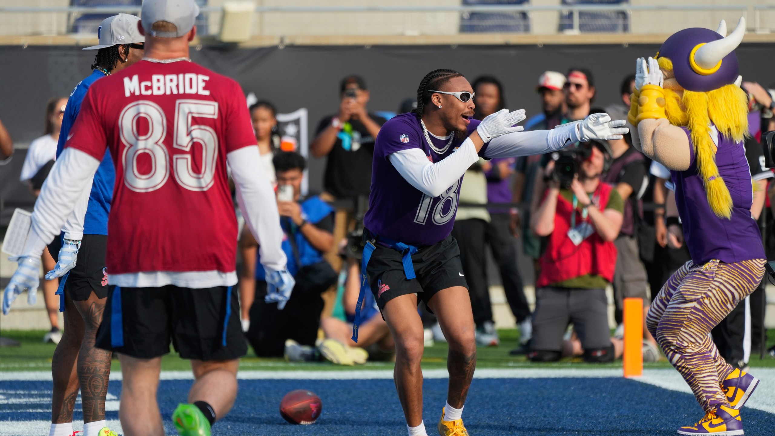 NFC wide receiver Justin Jefferson (18), of the Minnesota Vikings, celebrates after scoring a touchdown during the flag football event at the NFL Pro Bowl, Sunday, Feb. 2, 2025, in Orlando. (AP Photo/John Raoux)