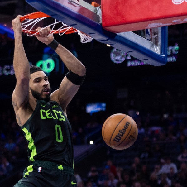 Boston Celtics' Jayson Tatum dunks during the first half of an NBA basketball game against the Philadelphia 76ers, Sunday, Feb. 2, 2025, in Philadelphia. (AP Photo/Chris Szagola)