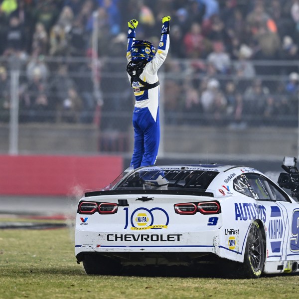 Chase Elliott celebrates after winning a NASCAR Cup Series auto race at Bowman Gray Stadium, Sunday, Feb. 2, 2025, in Winston-Salem, N.C. (AP Photo/Matt Kelley)