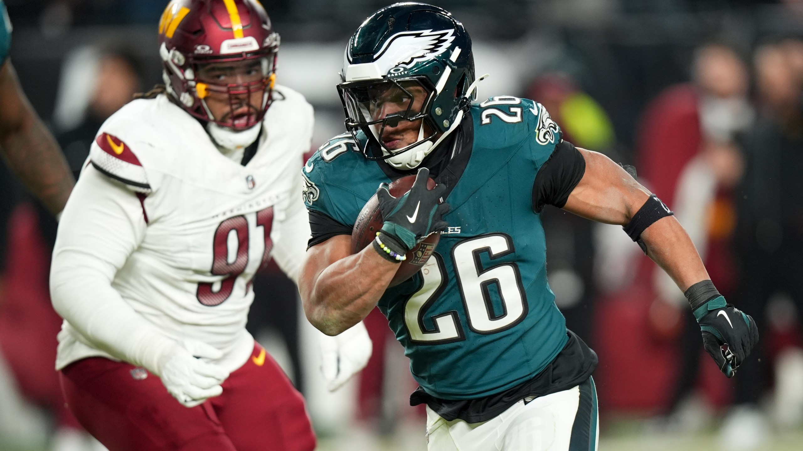 Philadelphia Eagles running back Saquon Barkley runs against the Washington Commanders during the second half of the NFC Championship NFL football game, Sunday, Jan. 26, 2025, in Philadelphia. (AP Photo/Chris Szagola)