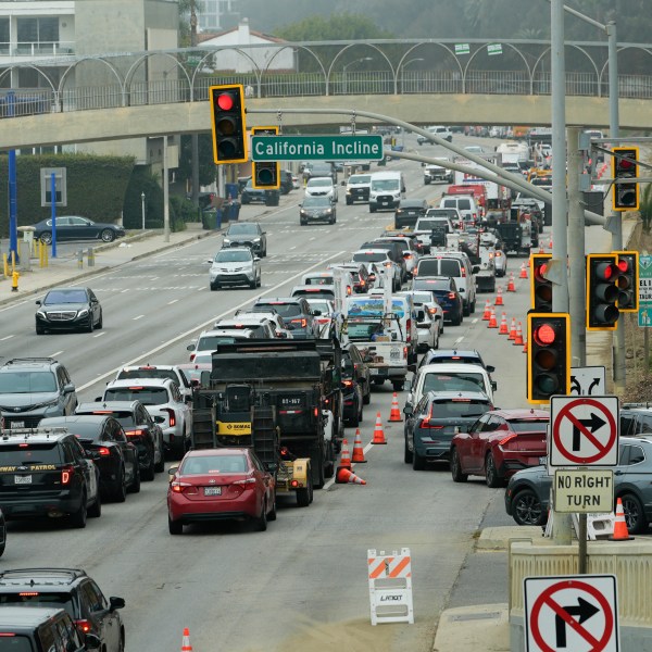 Motorists line up along Pacific Coast Highway near the Palisades Fire zone Monday, Feb. 3, 2025, in Santa Monica, Calif. (AP Photo/Damian Dovarganes)