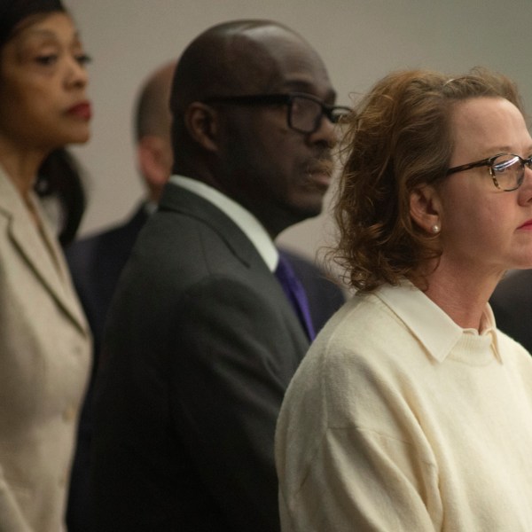 Former Brunswick Judicial Circuit Jackie Johnson stands with her defense team as court opens Thursday, Jan. 30, 2025, in Brunswick, Ga., where she is being tried on charges of violating her oath of office and obstruction of justice in the death of Ahmaud Arbery. (Terry Dickson/The Brunswick News via AP, Pool)