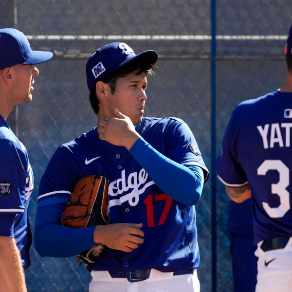 Los Angeles Dodgers two-way player Shohei Ohtani (17) works out during spring training baseball practice, Saturday, Feb. 15, 2025, in Phoenix. (AP Photo/Ashley Landis)