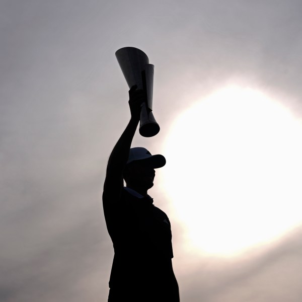 Ludvig Åberg, of Sweden, poses with the trophy after winning the Genesis Invitational golf tournament Sunday, Feb. 16, 2025, in San Diego. (AP Photo/Gregory Bull)