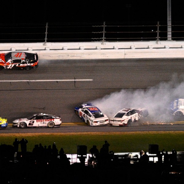 Denny Hamlin (11) and Cody Ware (51) collide between Turns 3 and 4 on the final lap during the NASCAR Daytona 500 auto race at Daytona International Speedway, Sunday, Feb. 16, 2025, in Daytona Beach, Fla. (AP Photo/Phelan M. Ebenhack)