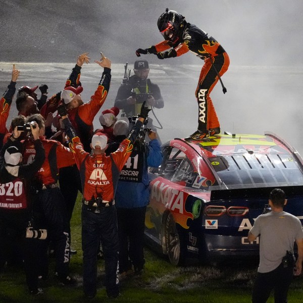 William Byron, on car, celebrates with his pit crew after winning the NASCAR Daytona 500 auto race Sunday, Feb. 16, 2025, at Daytona International Speedway in Daytona Beach, Fla. (AP Photo/Chris O'Meara)