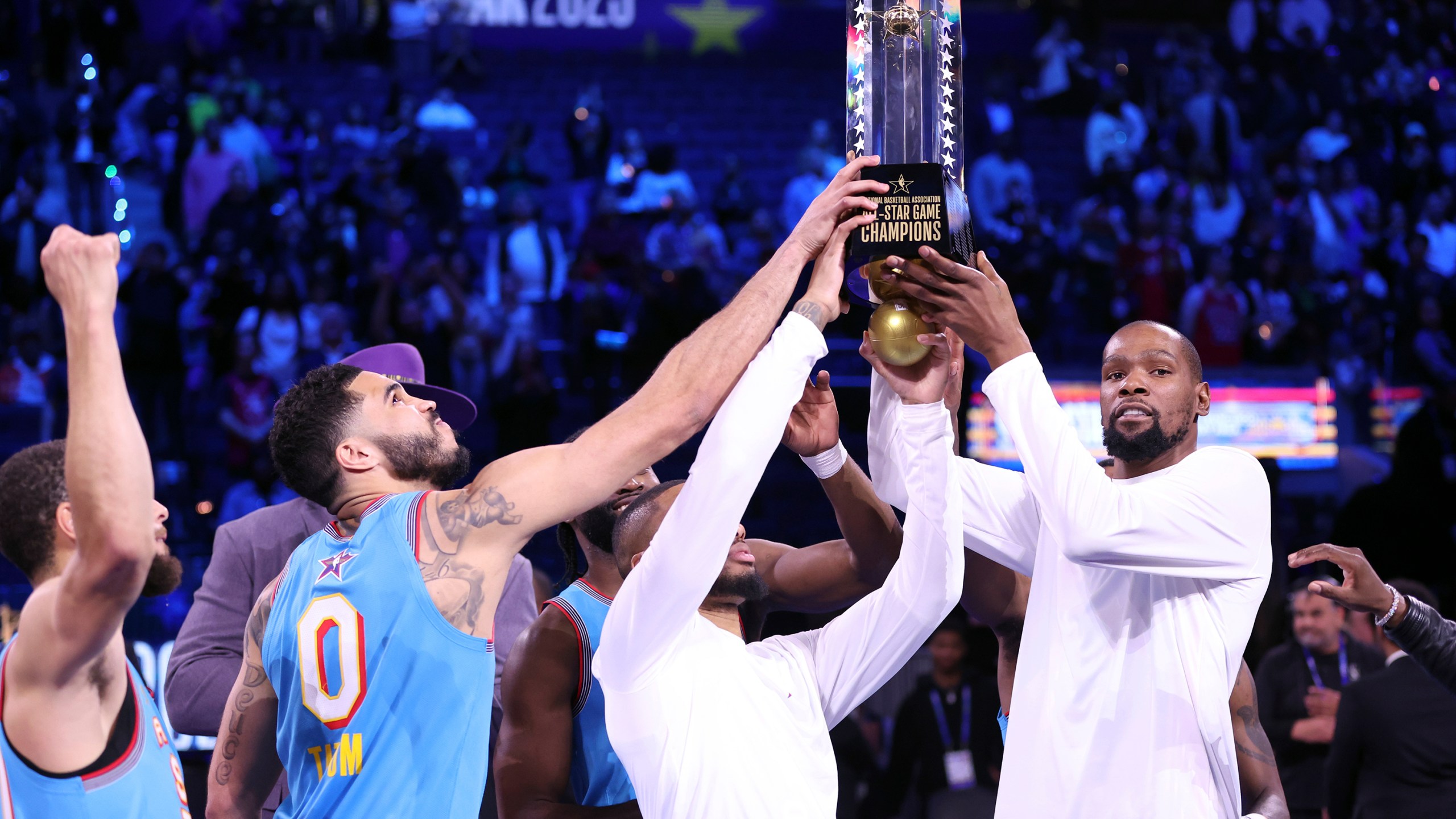 Team Shaq's Kevin Durant, Damian Lillard, Jayson Tatum and Stephen Curry hold up the championship trophy following the 74th NBA All-Star Game in San Francisco, Sunday, Feb. 16, 2025. (Scott Strazzante/San Francisco Chronicle via AP)