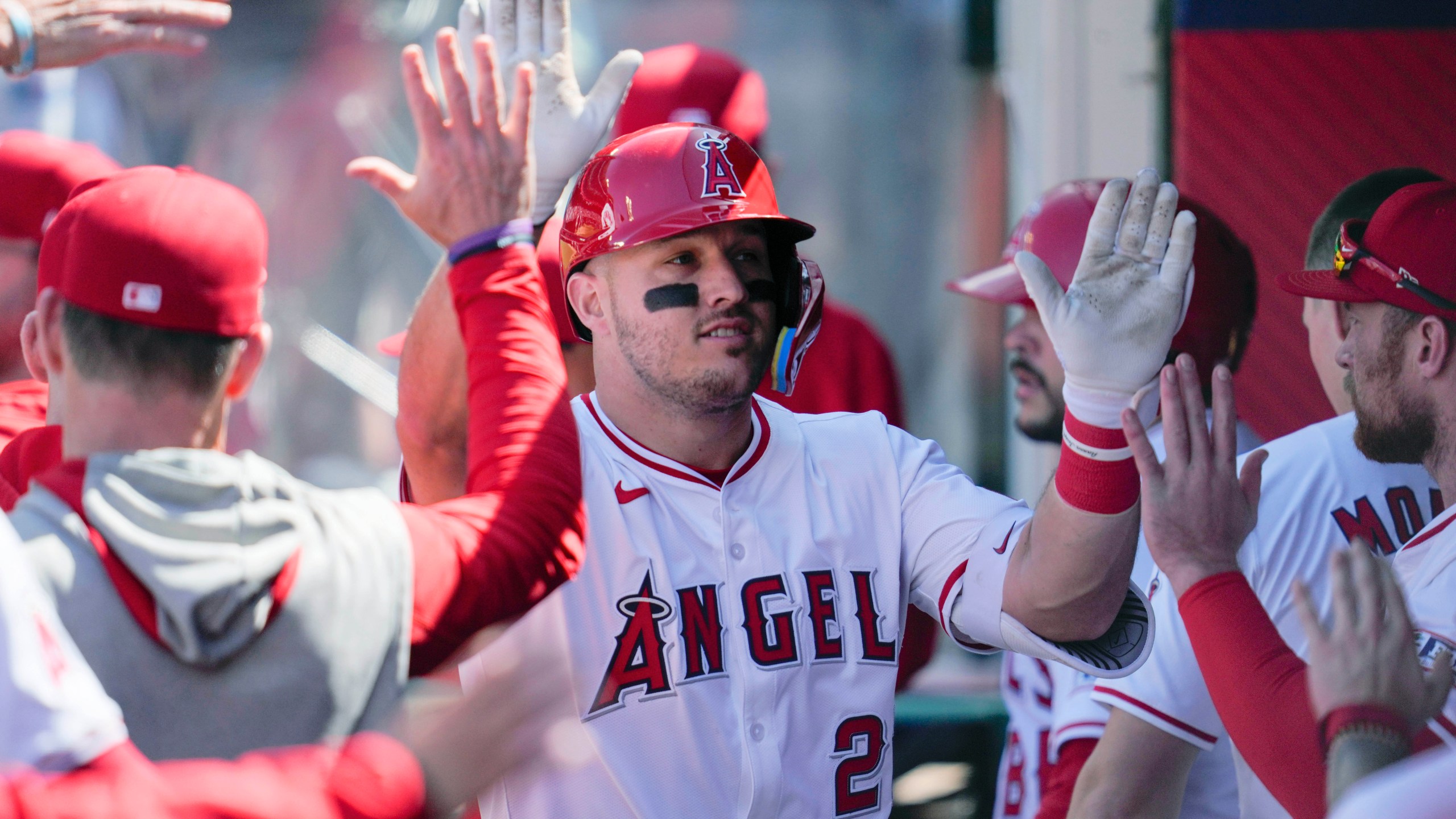 FILE - Los Angeles Angels designated hitter Mike Trout celebrates in the dugout after hitting a home run during the sixth inning of a baseball game against the Baltimore Orioles in Anaheim, Calif., April 24, 2024. (AP Photo/Ashley Landis, File)