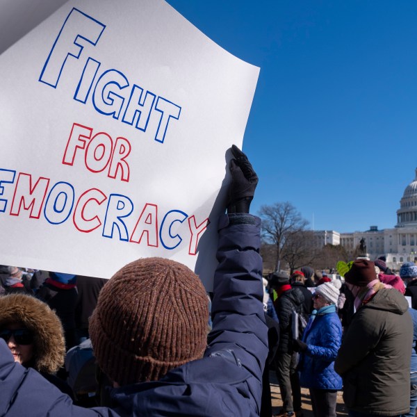 People protest as part of the “No Kings Day” protest on Presidents Day in Washington, in support of federal workers and against recent actions by President Donald Trump and Elon Musk, Monday, Feb. 17, 2025, by the Capitol in Washington. The protest was organized by the 50501 Movement, which stands for 50 Protests 50 States 1 Movement. (AP Photo/Jacquelyn Martin)