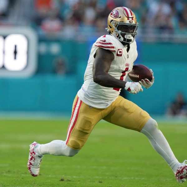 FILE - San Francisco 49ers wide receiver Deebo Samuel Sr. (1) runs for a first down during the first half of an NFL football game against the Miami Dolphins, Dec. 22, 2024, in Miami Gardens, Fla. (AP Photo/Lynne Sladky, File)