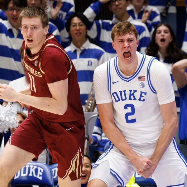 Duke's Cooper Flagg (2) reacts ahead of Florida State's Christian Nitu (11) after blocking Nitu's shot in the second half of an NCAA college basketball game in Durham, N.C., Saturday, March 1, 2025. (AP Photo/Ben McKeown)