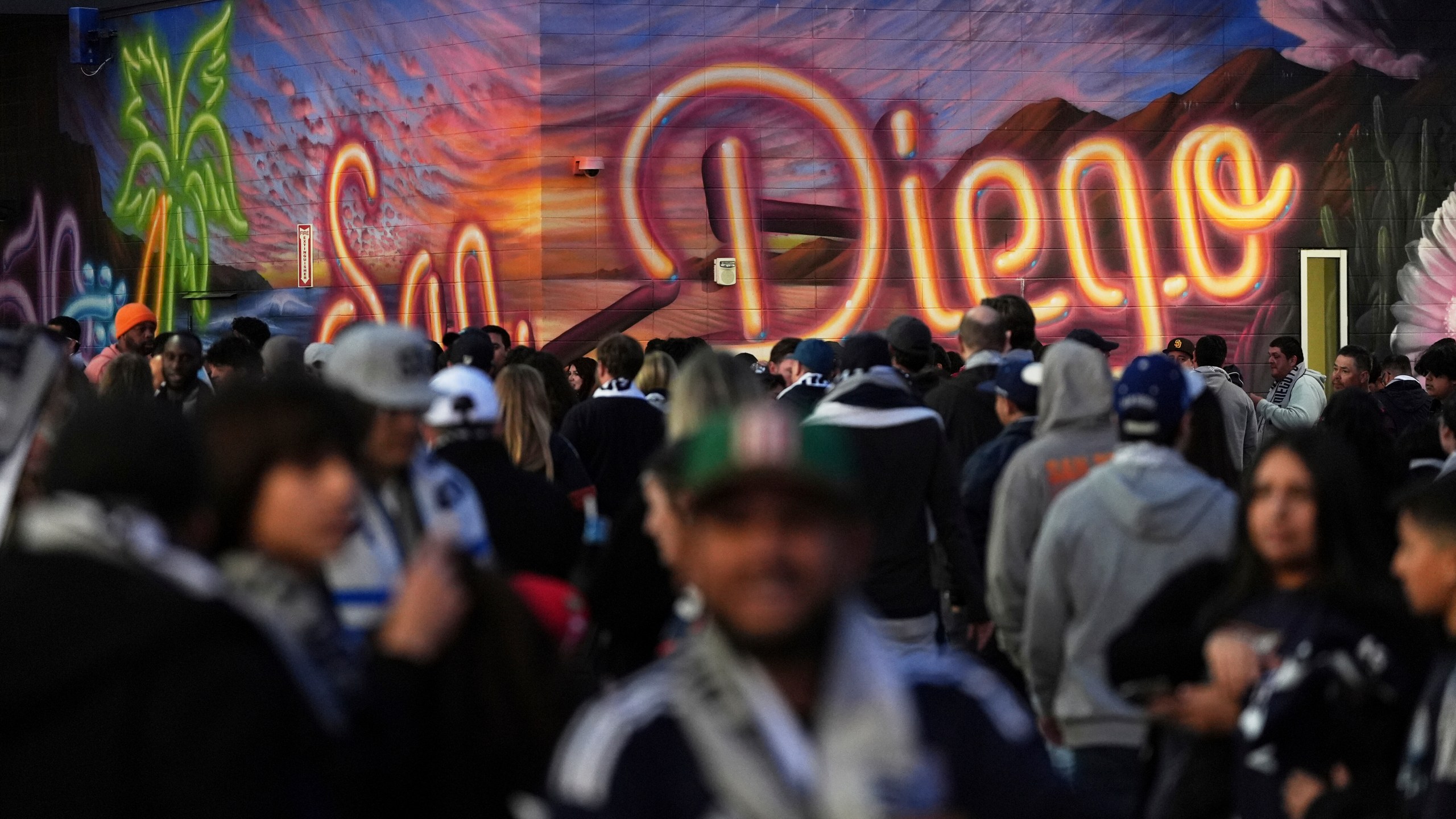 Fans arrive before San Diego FC hosts St. Louis City in an MLS soccer match Saturday, March 1, 2025, in San Diego. (AP Photo/Gregory Bull)