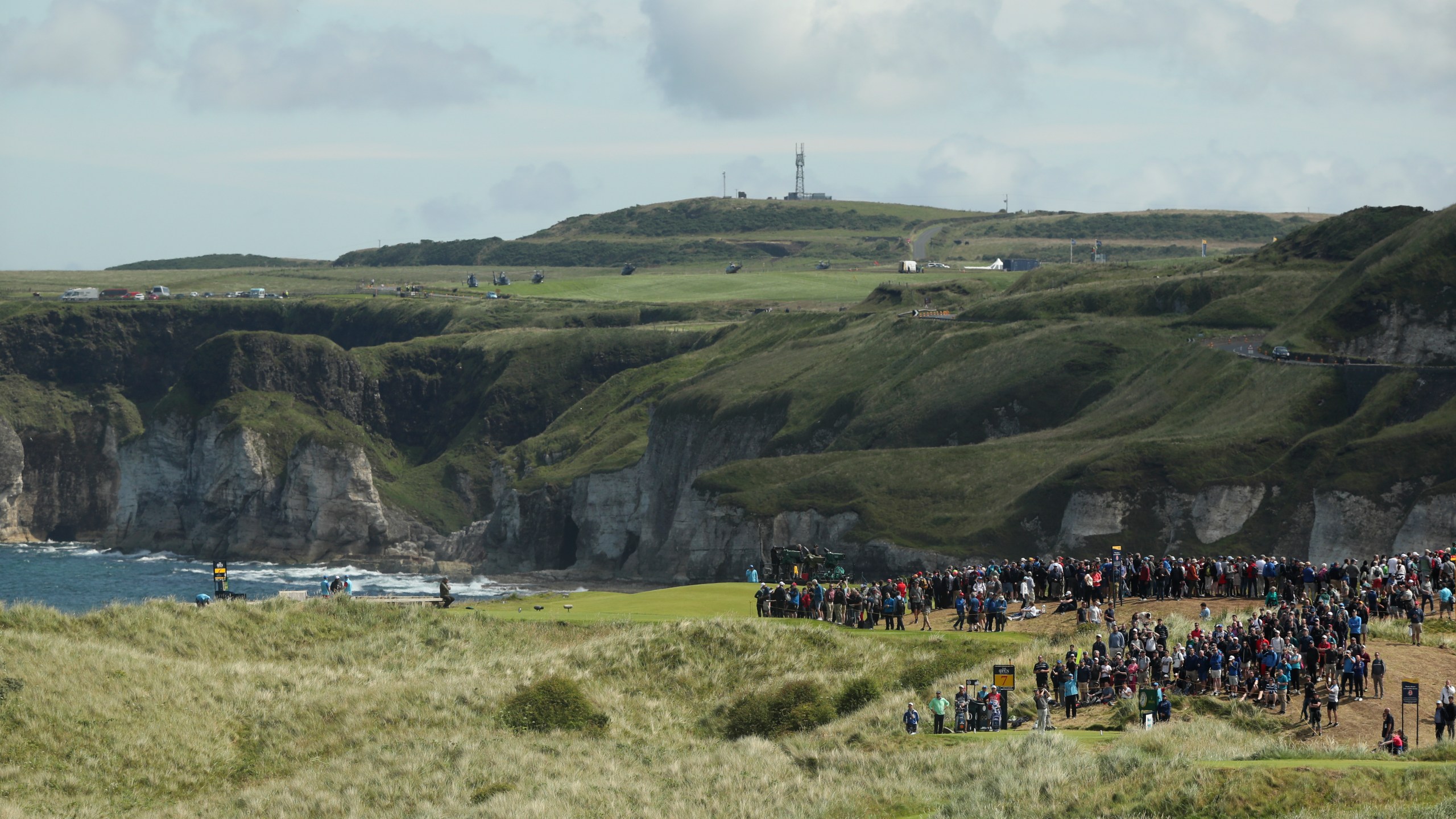 FILE - Golfers play from the 7th hole during the third round of the British Open Golf Championships at Royal Portrush in Northern Ireland, Saturday, July 20, 2019.(AP Photo/Jon Super, File)