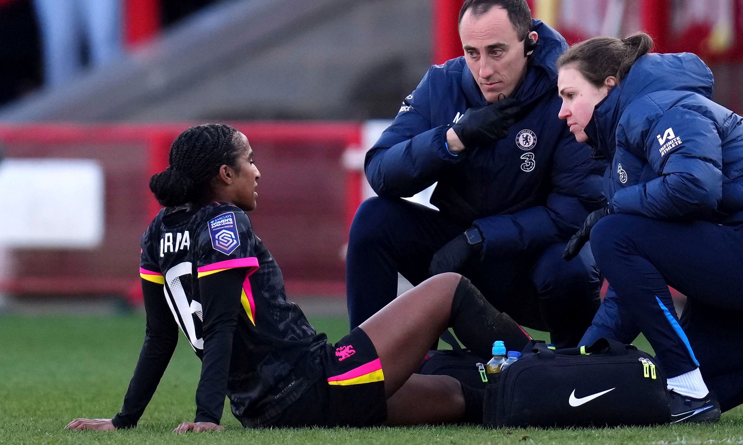 Chelsea's Naomi Girma receives treatment before being substituted during the Barclays Women's Super League match at the Broadfield Stadium, Brighton and Hove, England, Sunday, March 2, 2025. (John Walton/PA via AP)