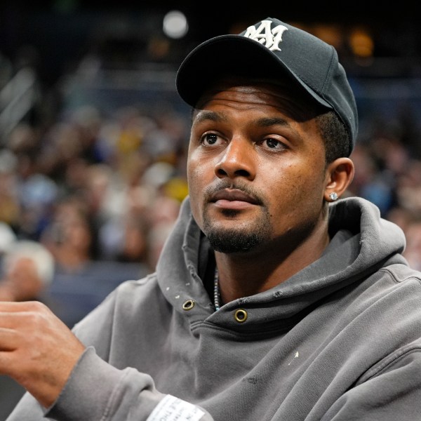 FILE - Cleveland Browns quarterback Deshaun Watson watches during the second half of an NBA basketball game between the Orlando Magic and the Golden State Warriors, Wednesday, March 27, 2024, in Orlando, Fla. (AP Photo/John Raoux, File)