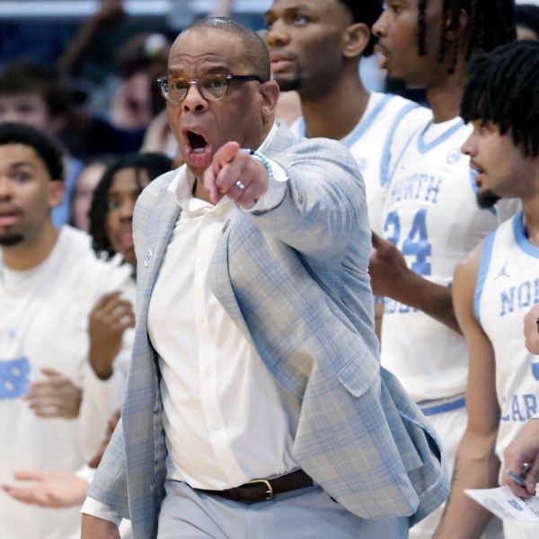 North Carolina head coach Hubert Davis yells instructions to the team during the first half of an NCAA college basketball game against Duke, Saturday, March 8, 2025, in Chapel Hill, N.C. (AP Photo/Chris Seward)