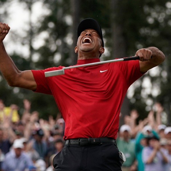 FILE - In this April 14, 2019, file photo, Tiger Woods reacts as he wins the Masters golf tournament at Augusta National in Augusta, Ga. (AP Photo/David J. Phillip, File)